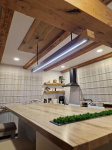 a kitchen with a wooden counter top in a room at Walthouse in Vulcan