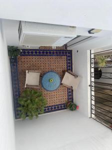 a room with a couch with plants on it at Dar Sami, Riad Bab Kasbah in Tangier