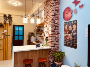 A kitchen or kitchenette at Ramble Travel Homestay