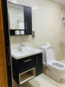 a bathroom with a sink and a toilet at sand magic camp in Wadi Rum