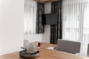 Televízia a/alebo spoločenská miestnosť v ubytovaní A CASA Turmalin
