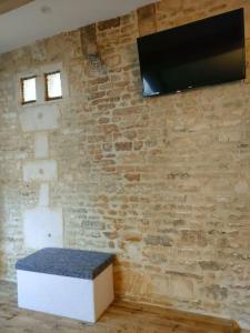 Μια τηλεόραση ή/και κέντρο ψυχαγωγίας στο Charmant studio typique & cosy au Cœur de Caen +7 φωτογραφίες