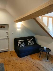 Χώρος καθιστικού στο Charmant studio typique & cosy au Cœur de Caen