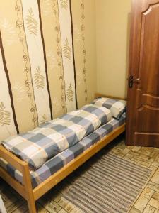a bed in a corner of a room at Julia in Uman