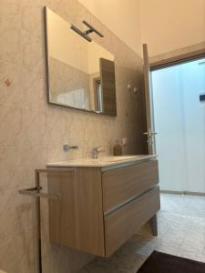 a bathroom with a sink and a mirror at Sweet home in Bordighera +14 photos