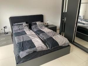 A bed or beds in a room at Aura blue