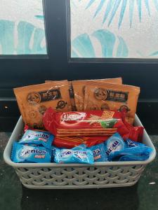 a basket filled with toothpaste and toothbrushes at Cozy 2room 6pax @ Menara Sentral in Bukit Mertajam