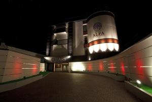 a night view of a building with an arena at Hotel Alfa Kyoto in Kyoto