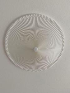 a white paper plate on top of a ceiling at Apartment Nr. 2 Bad Laasphe Altstadt in Bad Laasphe
