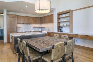 a kitchen with a dining room table and chairs at Highlands Westview 300 condo in Beaver Creek