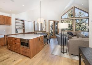 a kitchen and living room with a couch and a table at Highlands Westview 300 condo in Beaver Creek