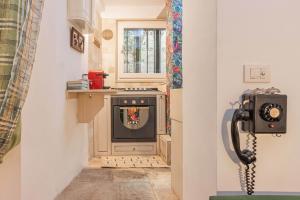 a kitchen with an old fashioned stove in a room at Extravacanza Central Station in Bari