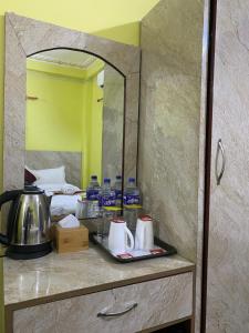 Voodi või voodid majutusasutuse Hotel Kavya Inn toas