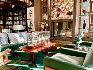 a room with couches and a table in a room at Marbella Boutique Art suites in Marbella