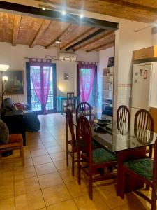 a kitchen and dining room with a table and chairs at Flat Plaza de España BCN in Barcelona