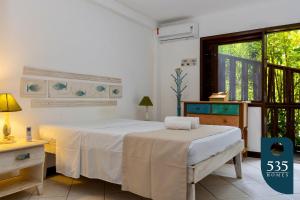 Ένα ή περισσότερα κρεβάτια σε δωμάτιο στο Oasis na Vila de Praia do Forte Casa 4 suítes. +46 φωτογραφίες