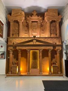 a room with a large stone building with columns at Art Hotel Downtown in Amman