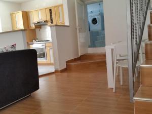 a living room with a kitchen and a dining room at Holiday Home Casa Matilde in Koromačno
