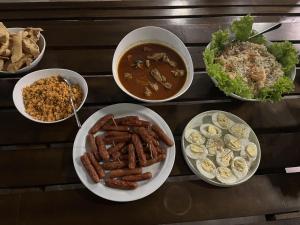 a group of bowls of food on a table at Aura Villa in Polonnaruwa