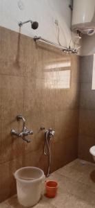 a bathroom with a shower and a sink in a room at Stay awhile in Ooty