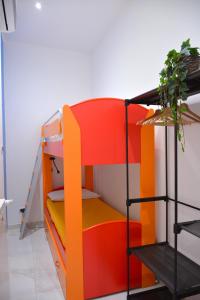 a room with a bunk bed and a shelf at Casa Chloé - vicino al Porto e Basilica San Nicola in Bari