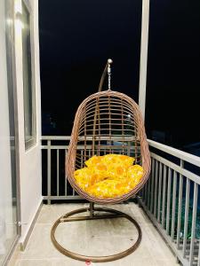 a bird cage sitting on top of a balcony at Khem Beach serviced apartment in Phú Quốc