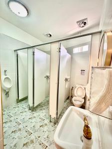 a bathroom with a toilet and a sink at Guesthouse Station in Bangkok +34 photos