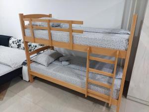 Postel nebo postele na pokoji v ubytování Apartman Aleksić u samom centru grada