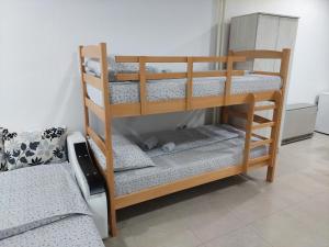 Postel nebo postele na pokoji v ubytování Apartman Aleksić u samom centru grada
