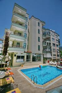The swimming pool at or close to Magi Apart Hotel