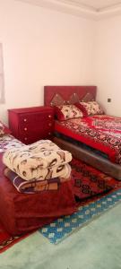 Postel nebo postele na pokoji v ubytování Gite Timit la maison Imazghn