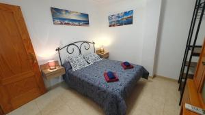 Łóżko lub łóżka w pokoju w obiekcie Rico Apartaments Ricosol