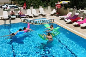 The swimming pool at or close to Magi Apart Hotel