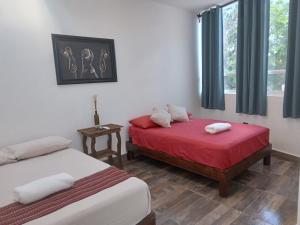 Postel nebo postele na pokoji v ubytování Villas Carlota Cancún