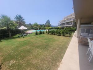 a view of a yard with a swimming pool at Luxury La Cala Golf Haven with terrace & pool in La Cala de Mijas