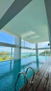 a view of a swimming pool in a house at [NEW LAUNCH] SUNRISE GURNEY SEAVIEW'63 无敌日出海景63 in George Town
