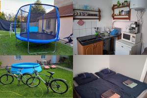 a room with a bed and a bike in the yard at Relax apartman in Nagykanizsa