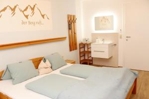 a bedroom with a bed and a sink at Riverhaus in Schladming