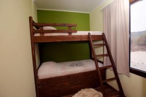 two bunk beds in a room with a window at HEAVEN HOUSE in Kavala