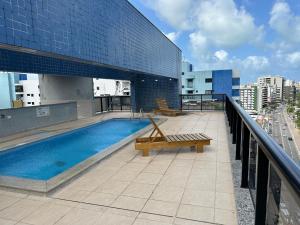 a swimming pool on the roof of a building at Neo 2.0 in Maceió