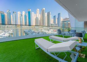 a balcony with a view of a city skyline at Vida Dubai Marina & Yacht Club , Hotel and Residences , Luxurious 2BR in Dubai
