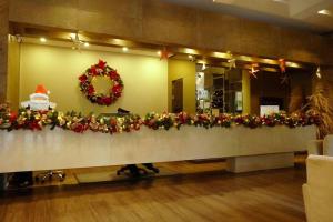 a long table with christmas decorations on it at Stylish 2 bedroom near Parque 93. FREE Parking. in Bogotá