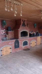 a brick wall with a brick oven in a room at Casa Sofia in Târgu Jiu