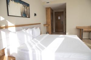 Кровать или кровати в номере Hotel Marwa Tashkent Pool&Spa