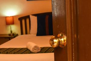 Postel nebo postele na pokoji v ubytování Balamku Hotel Petit