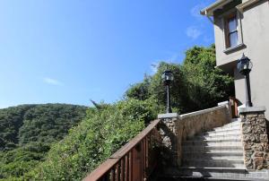 a stairway leading up to a house with at Livingstone Villa in Wilderness
