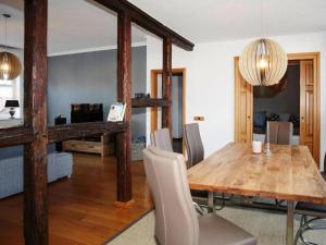 a dining room with a wooden table and chairs at Apartment, Wittenburg in Wittenburg