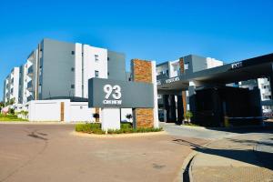 a building with a sign in front of it at On New Luxury stay 2 WITH BACK UP POWER in Midrand
