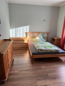 מיטה או מיטות בחדר ב-GraueMaus