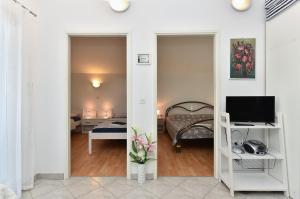 Postel nebo postele na pokoji v ubytování Apartment Mladen 1860